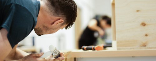 A student wood working for NMITE's BSc Sustainable Built Environment Degree