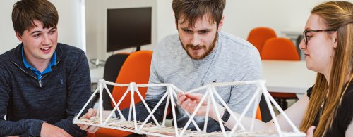 NMITE integrated engineering degree students building model bridge